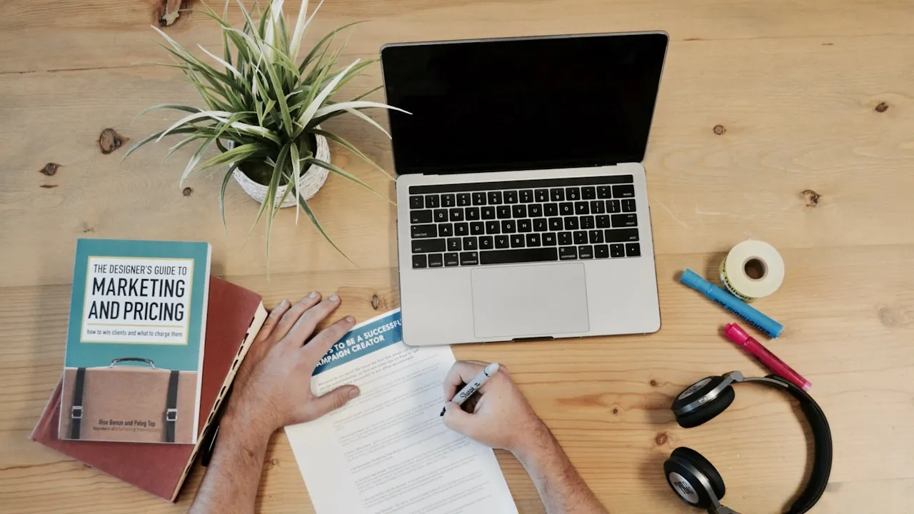 A person job-hunting and studying at home