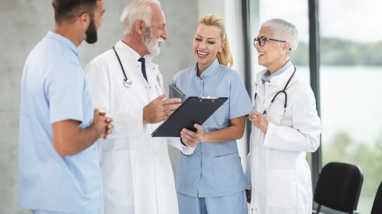 Medical professionals discussing patient notes