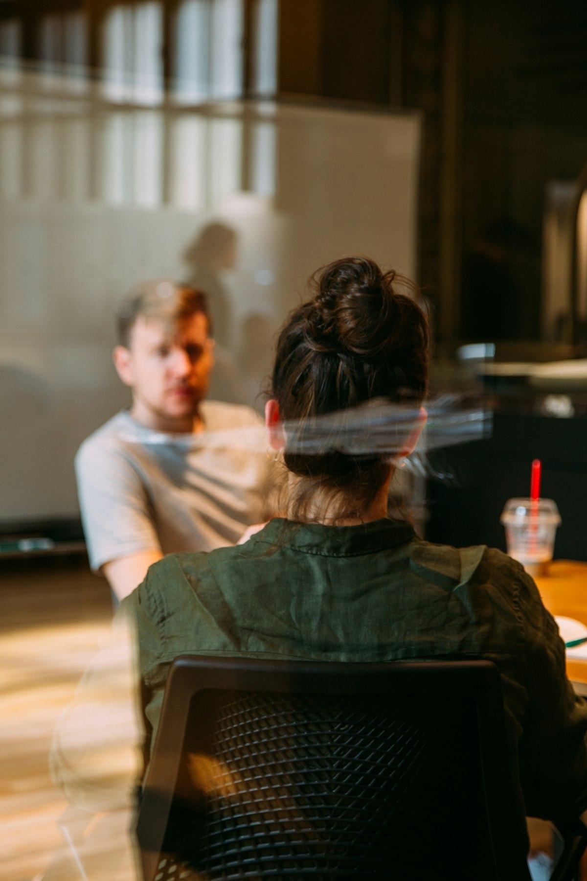 A focused one-on-one coaching session — executive education is built around the individual, not the lecture hall