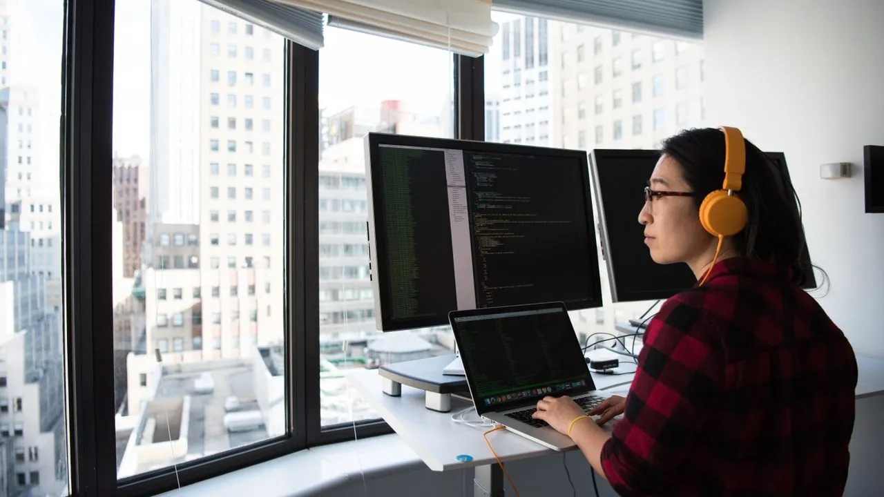 A marketer working remotely on a laptop