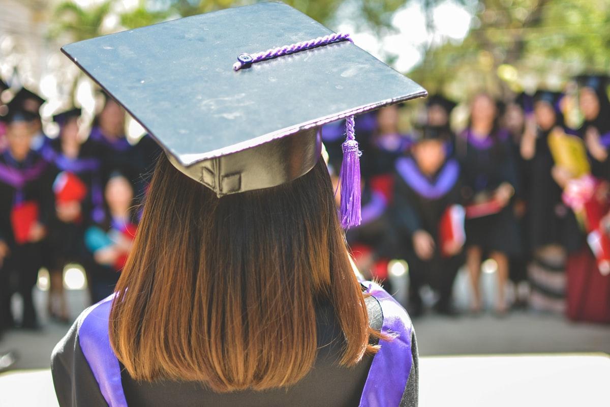 A graduate in academic regalia — a Level 3 business diploma is one of the most accessible first steps towards that moment