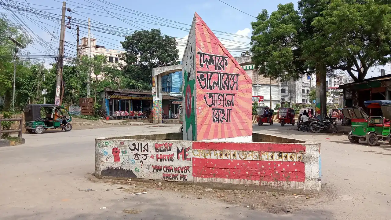 A small shop building beside a large office tower