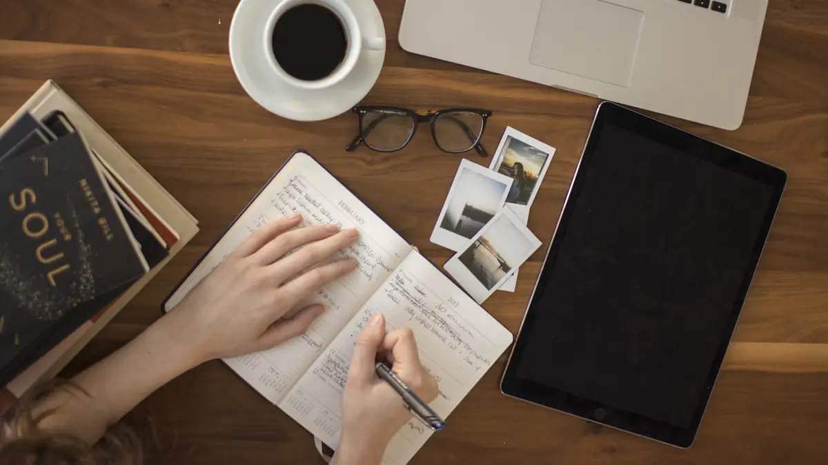 A tidy study desk with a laptop and notebook