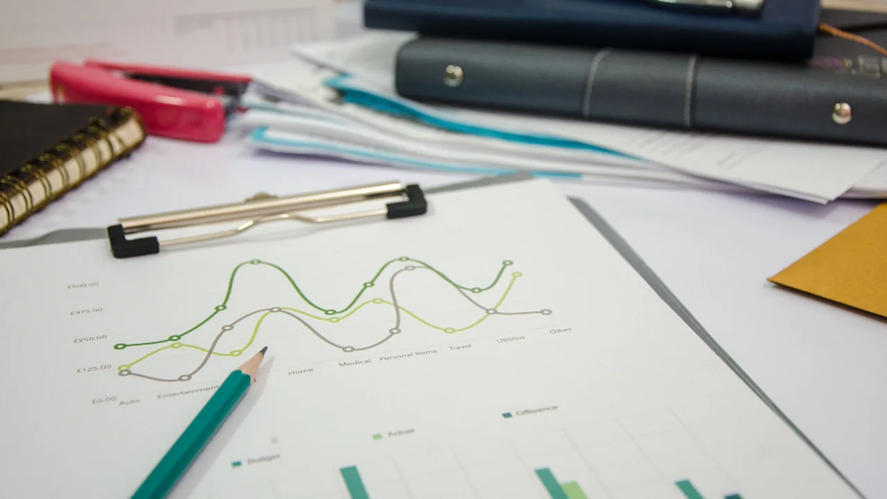 Analyst reviewing migration statistics on a chart