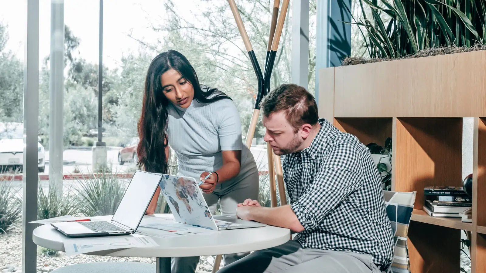 Marketing intern and supervisor reviewing progress across a placement timeline