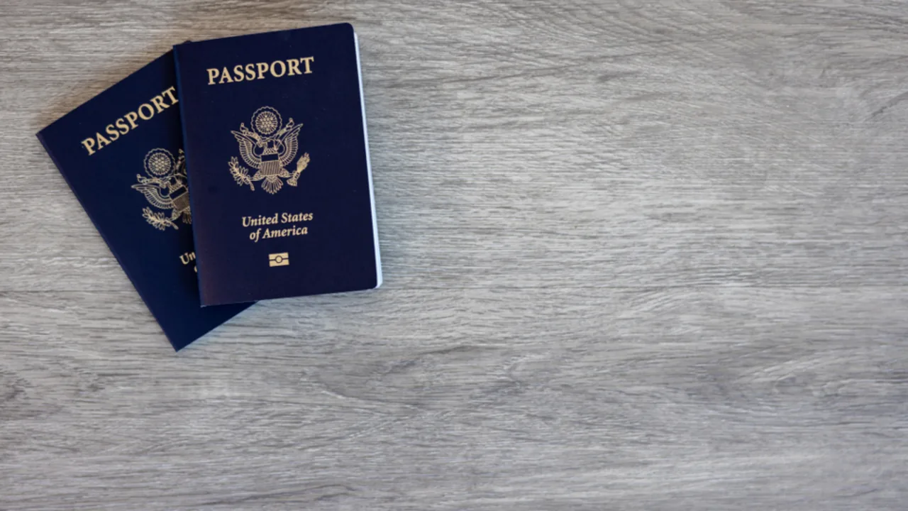 Passport and travel documents laid out on a desk