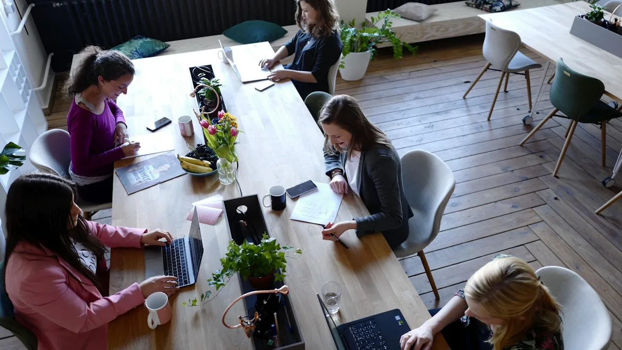 People collaborating and celebrating a work milestone