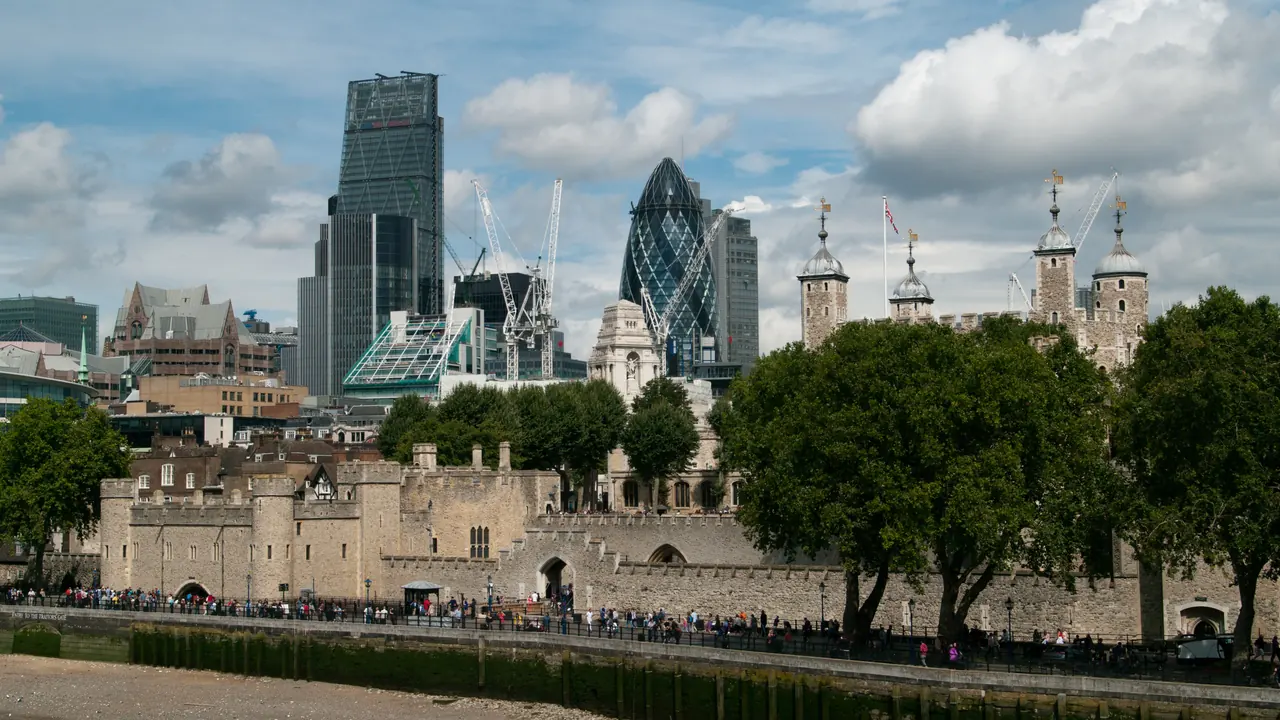 The Tower of London with the City of London skyline behind, representing international students travelling to the UK to study