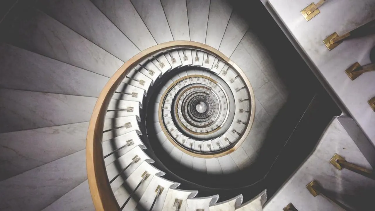 Looking up a spiral staircase in a modern building