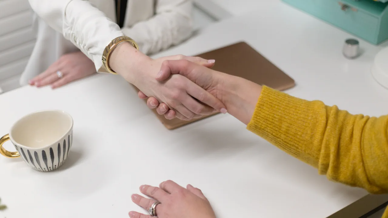 A new graduate negotiating a first job offer in the UK