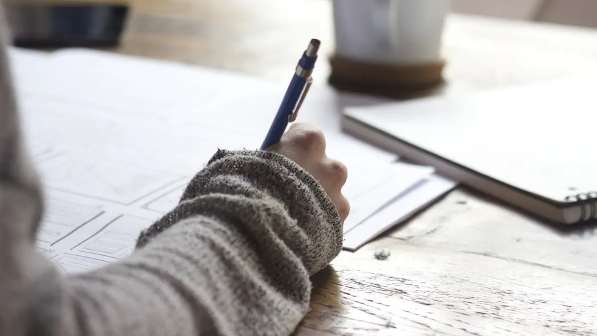 A person evaluating course options with notes