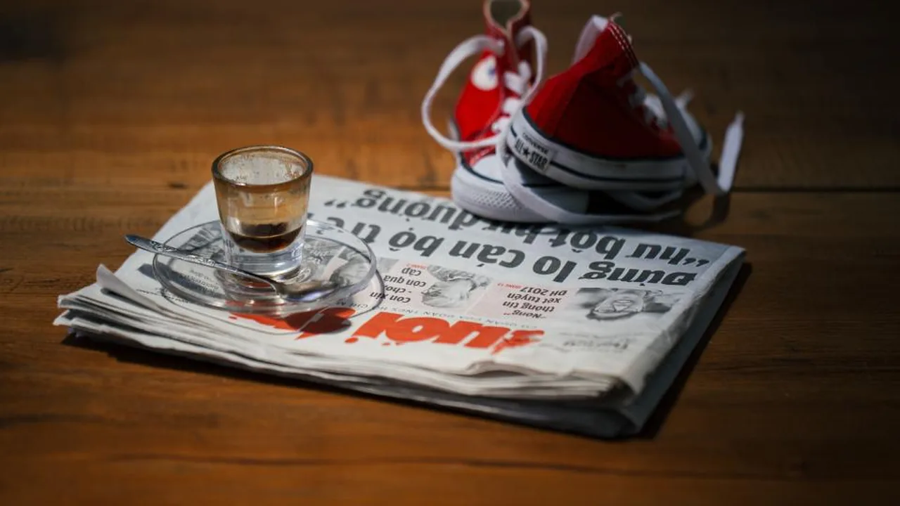 Reading economic headlines in a newspaper