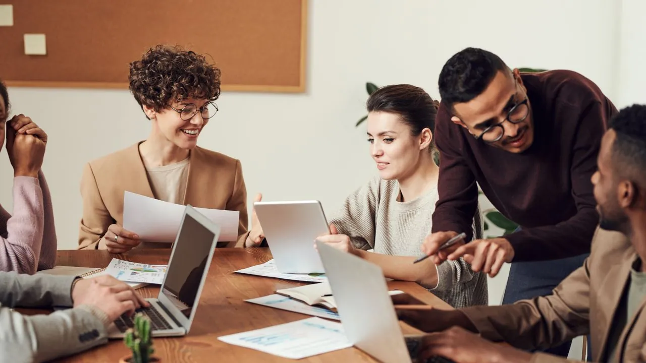 A cautious business meeting reviewing an agency proposal