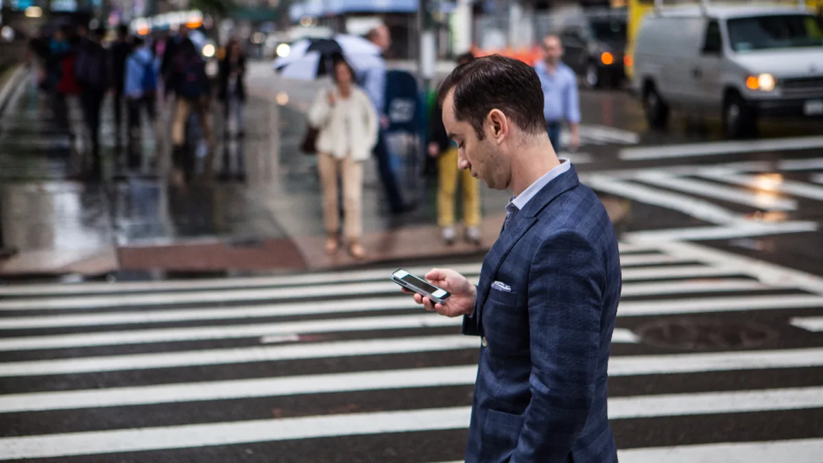A professional on a city street between meetings