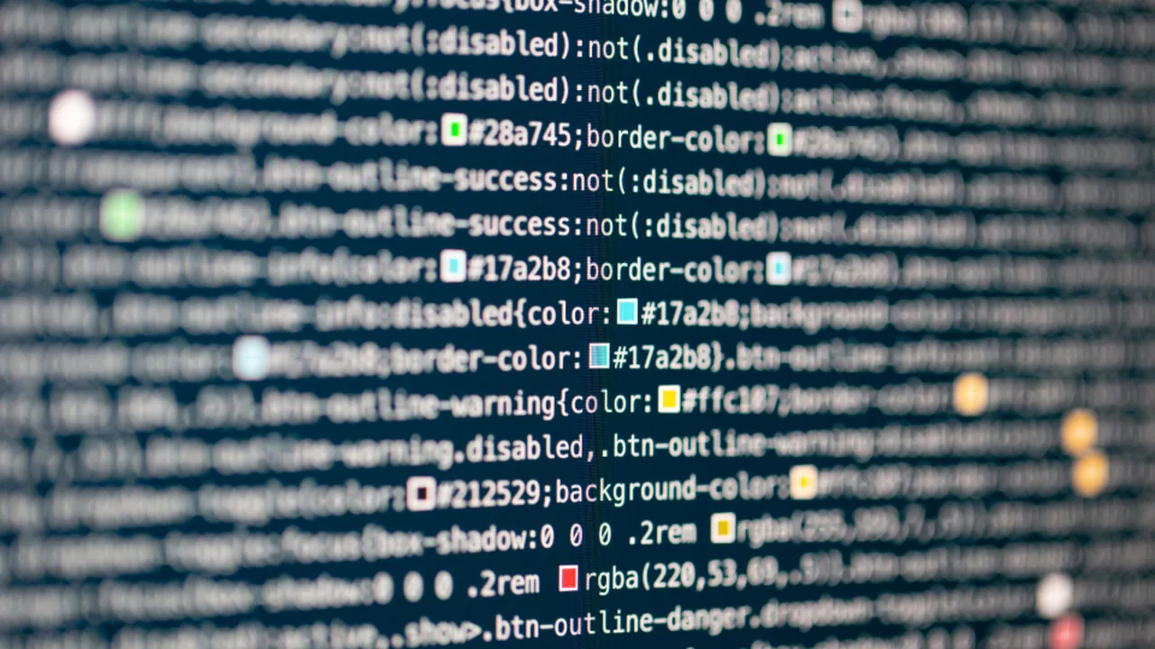 Developer reviewing code and compensation figures on screen