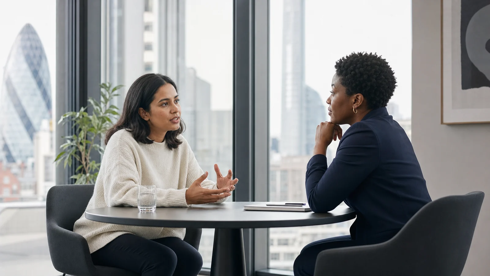Employee having a constructive conversation with their manager about feeling disconnected at work