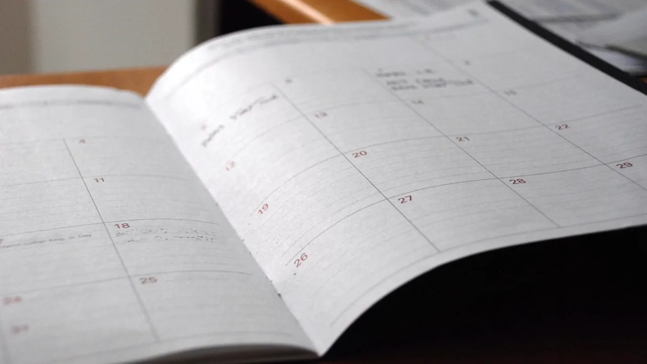 A study planner and calendar on a desk