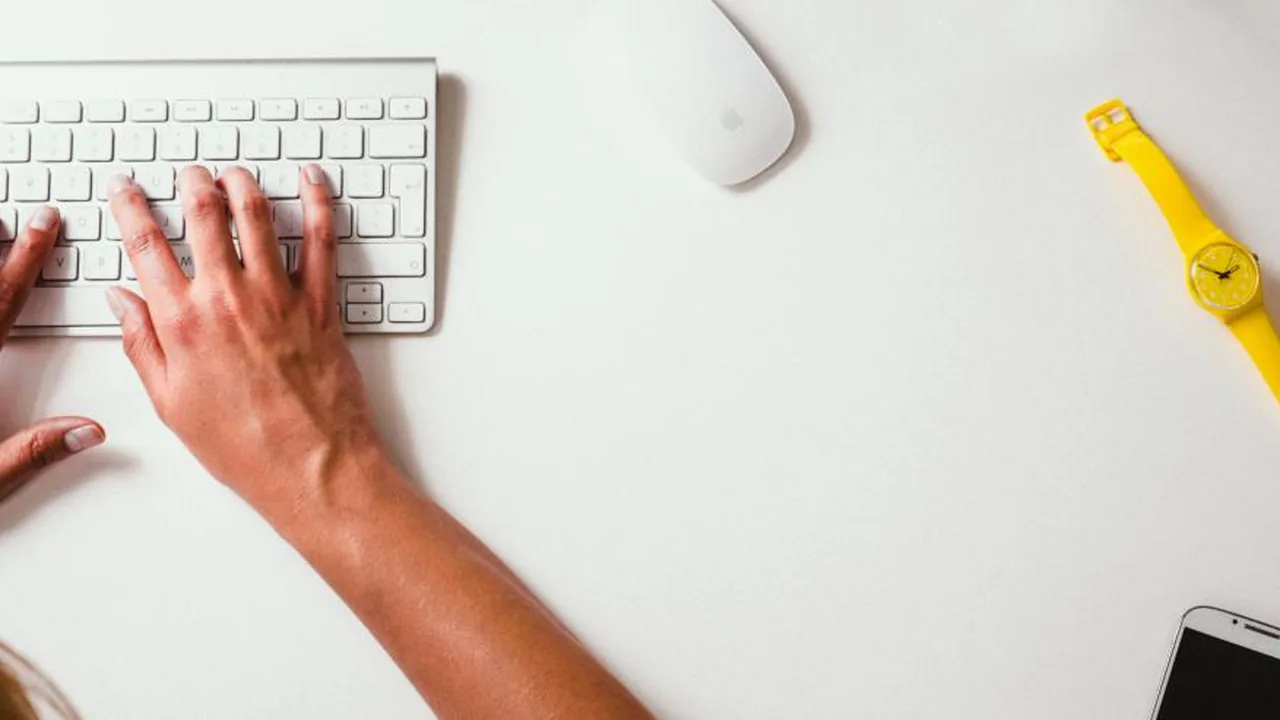 Person editing a CV document on a laptop
