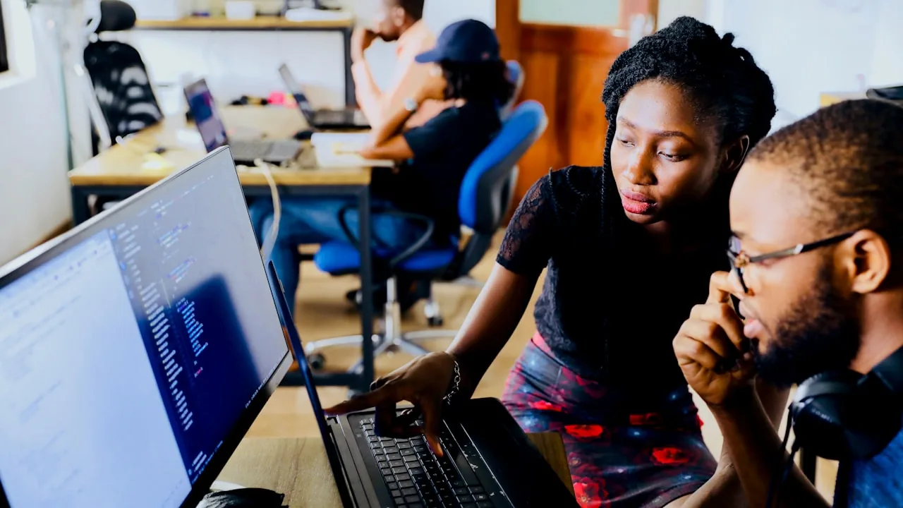 Person weighing up a decision at a desk