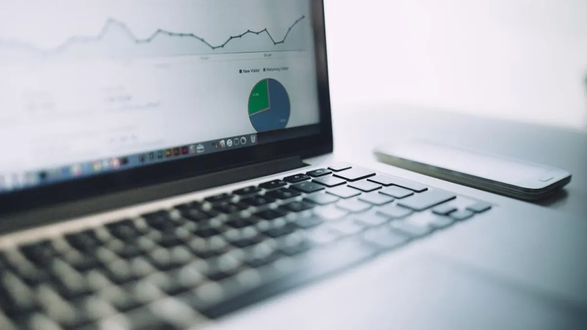 A laptop screen showing analytics charts